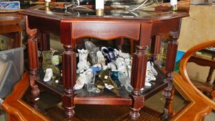 An octagonal glass topped side table