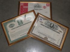 3 framed and glazed share certificates