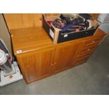 A 2 door cupboard sideboard with 4 drawers