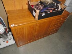 A 2 door cupboard sideboard with 4 drawers