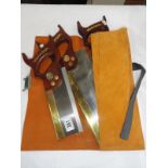 A quantity of Axminster saws and leather pouch.