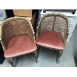 A pair of painted bregere back chairs