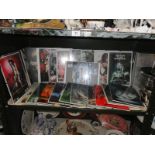 A shelf of fantasy prints