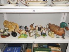 A shelf of assorted bird figures