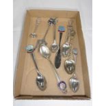 A quantity of collectors spoons.