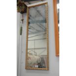 A long framed mirror