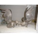 A pair of large silver plated fighting cocks/cockerals