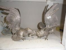 A pair of large silver plated fighting cocks/cockerals