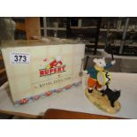 A boxed Royal Doulton Rupert the Bear figure 'banging on his drum' with certificate.