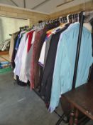 A rack of clothes including shirts etc.