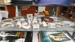 An assortment of china ornaments including Goss crested ware, James Kent, Wedgwood Jasper ware,