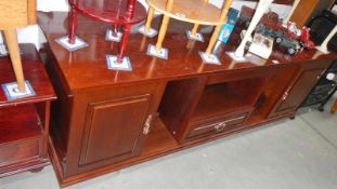 A dark wood stained sideboard