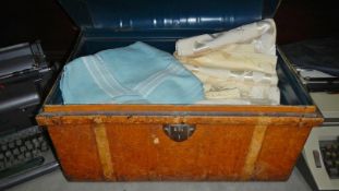 A tin trunk with contents