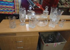 A quantity of cut glass items including decanters