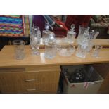 A quantity of cut glass items including decanters