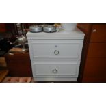 A white melamine 2 drawer chest