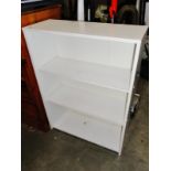 A white bookshelf with 3 shelves