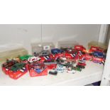 A shelf of Die-Cast models including corgi