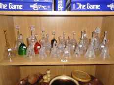 A shelf of glass bells