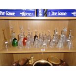 A shelf of glass bells