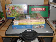 A shelf of games & puzzles