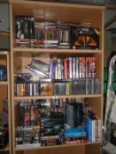 3 shelves of Dvd's, TV box sets, cassettes & CD's etc.