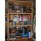3 shelves of Dvd's, TV box sets, cassettes & CD's etc.