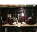 A shelf of miscellaneous including coloured glass & pictures etc.