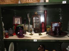 A shelf of miscellaneous including coloured glass & pictures etc.