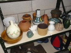 A shelf of assorted pots