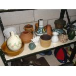 A shelf of assorted pots