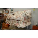 A 2 seater sofa with flower print