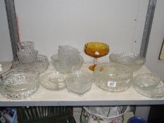 A shelf of assorted glassware