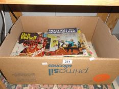 A box of DIY Practical Household magazines etc.