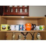 A shelf of assorted mugs