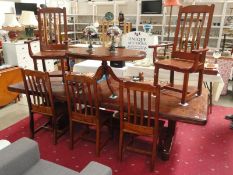 A large mahogany heavy dining table & 5 chairs