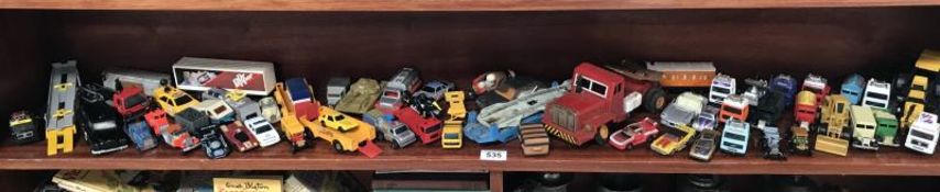A shelf of assorted die-cast toys