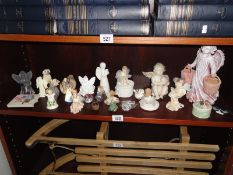 A quantity of angel figurines etc.