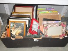 A box of photo frames etc.