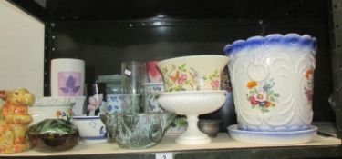 A shelf of plant pots, vases etc.