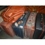 A quantity of old suitcases.