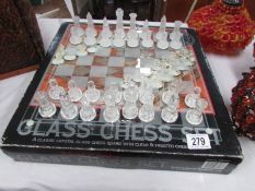 A boxed glass chess set.