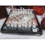 A boxed glass chess set.