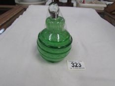 A pear shaped green glass scent bottle.