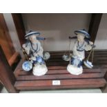 A pair of Chinese fishermen figures.