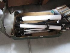 A box of telescopes and tripods