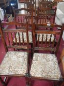 A set of 4 dark wood stained chairs with tapestry seats featuring castle.