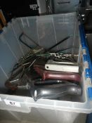 A box of saws including hack saw, tile saw, wood saws etc.