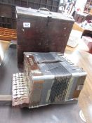 A boxed piano accordion.