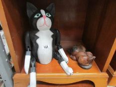 A jointed wooden cat and one other.